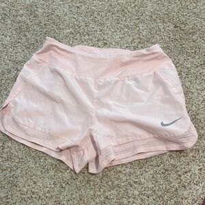 Pink Nike athletic shorts, adult small